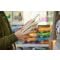 Pet parent comparing dog food options and feeding information